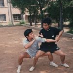 Masters and Training | 1991 Practicing push hands with Master Zhang Lianen near his sports store